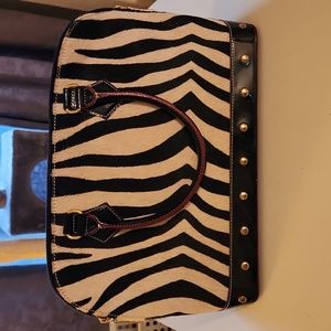 Brand new pony hair and black Arcadia satchel never used